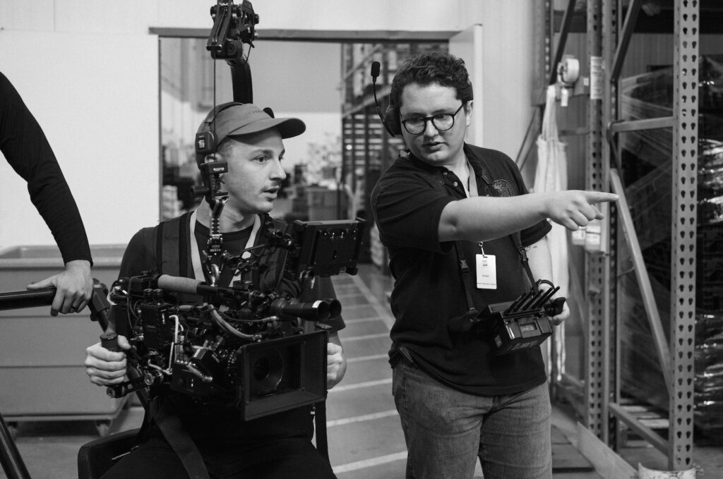 Braxton Wallis directing crew member with camera