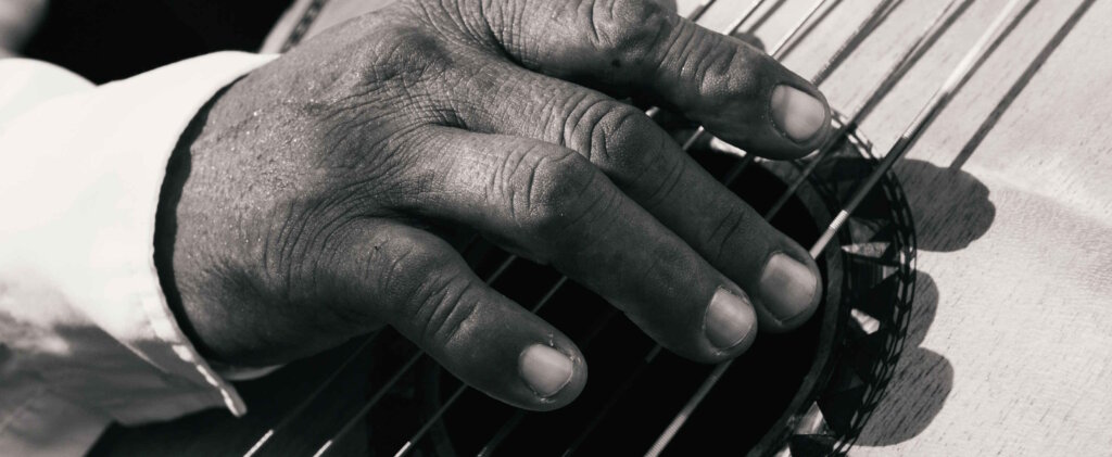 A Man Playing a Guitar