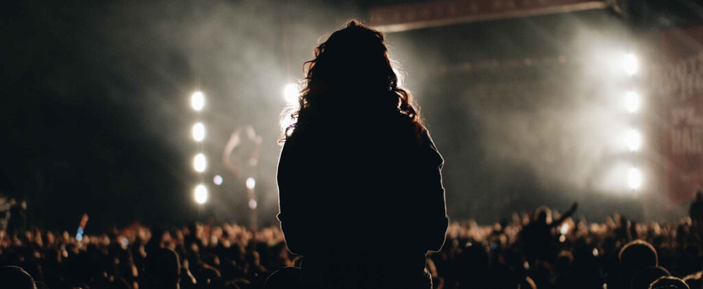 Artists in front of a large crowd