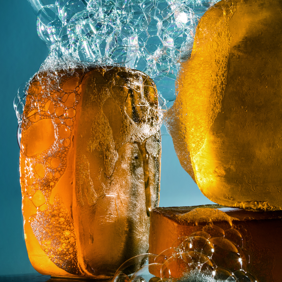 Close-up Of Yellow Soaps With Foam And Bubbles