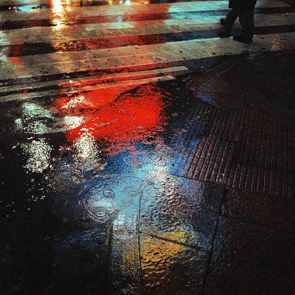 City Lights Reflecting On Wet Ground From Rain